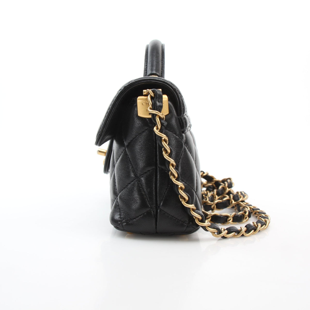 Chanel black lambskin mini flap handbag with top handle, shown front view