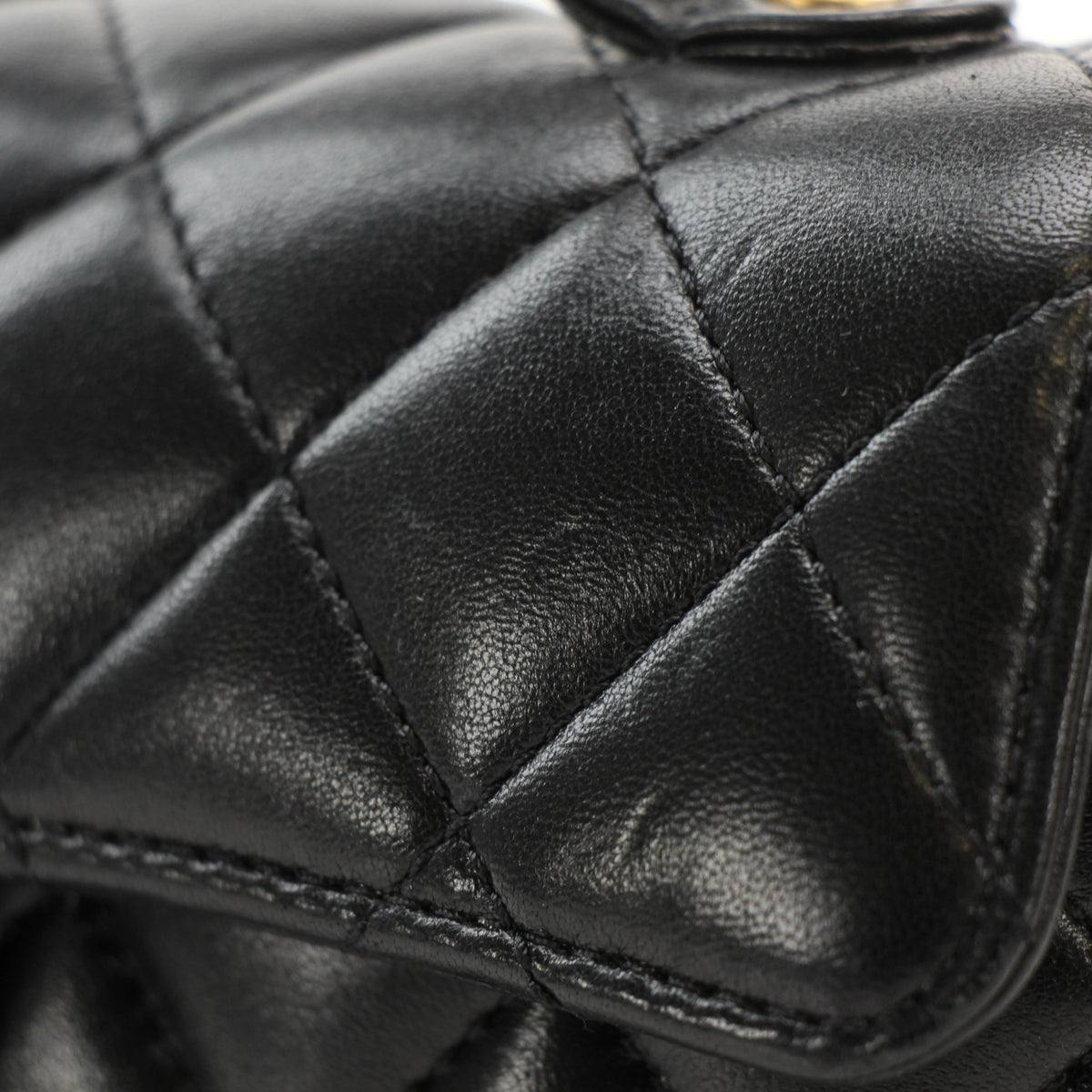 Chanel black lambskin mini flap handbag with top handle, gold-tone hardware