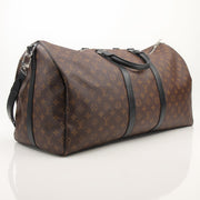 Louis Vuitton Keepall Bandoulière 55 travel bag by Gold & Beyond, showing the iconic monogram canvas with leather trim and handles.