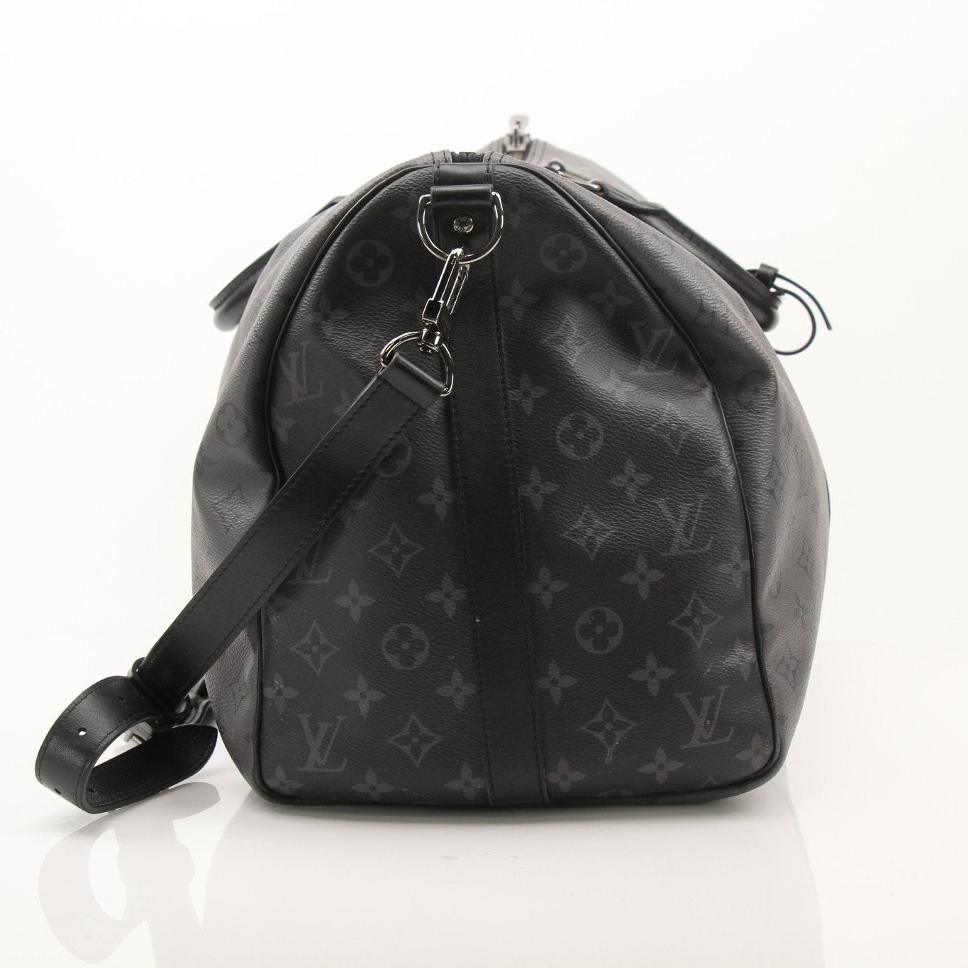 Gold & Beyond Louis Vuitton Keepall 50 bandoulière travel bag with leather handles and adjustable strap, showing front view.