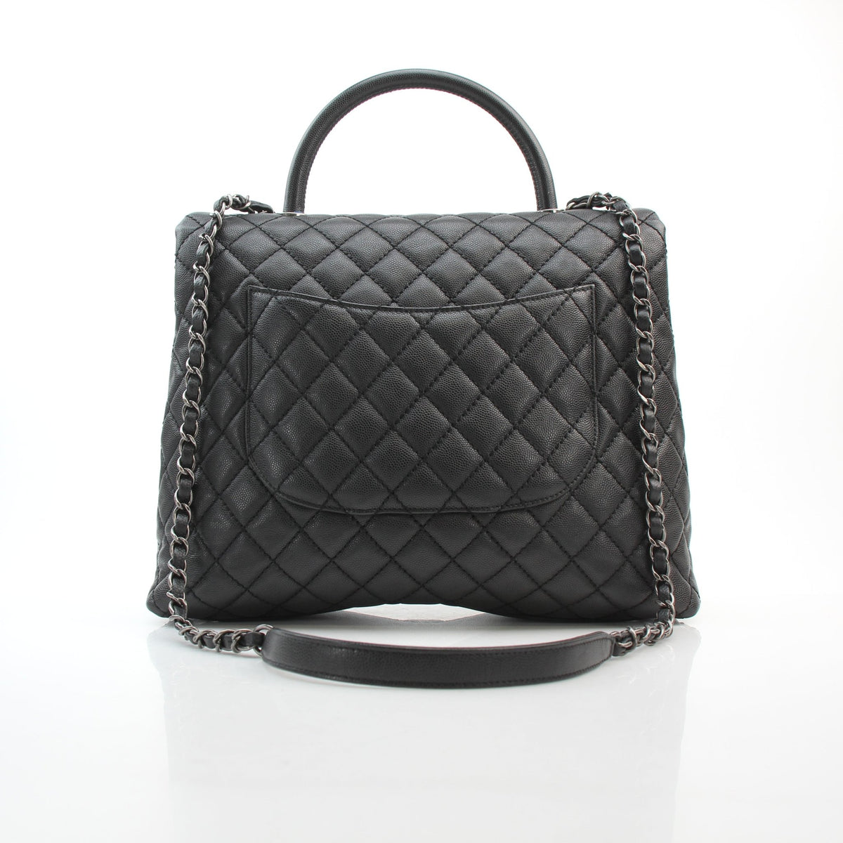 Chanel black caviar leather large Coco Handle flap handbag with structured top handle and gold-tone hardware
