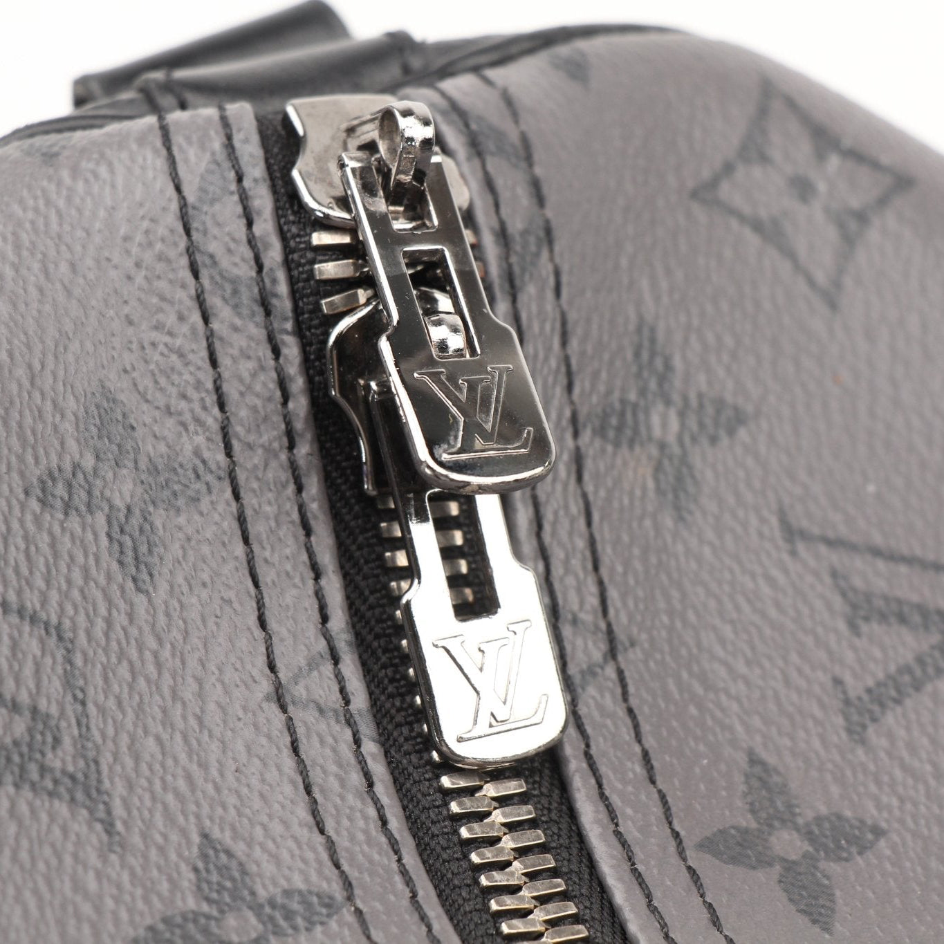 Louis Vuitton Keepall 50 travel bag with leather handles and gold hardware, designed for stylish, spacious travel.