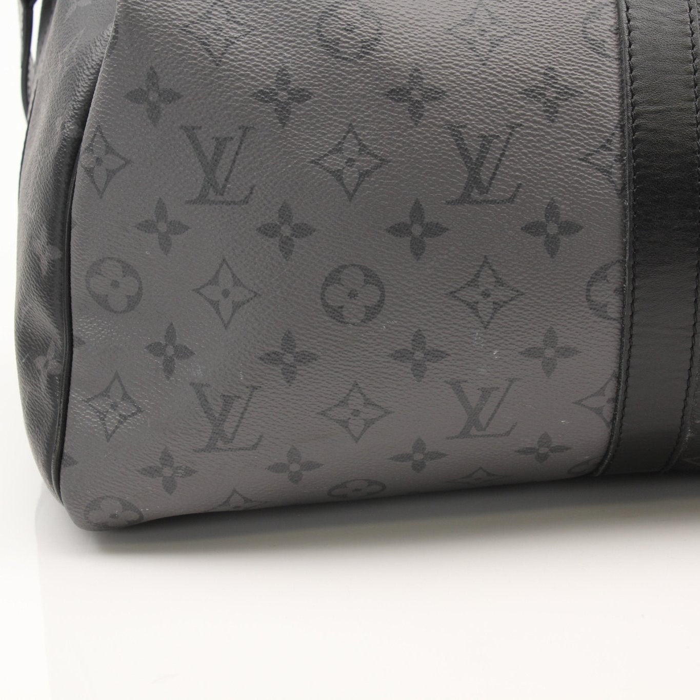 Gold & Beyond Louis Vuitton Keepall 50 travel bag with leather handles and logo print, shown on a plain background.