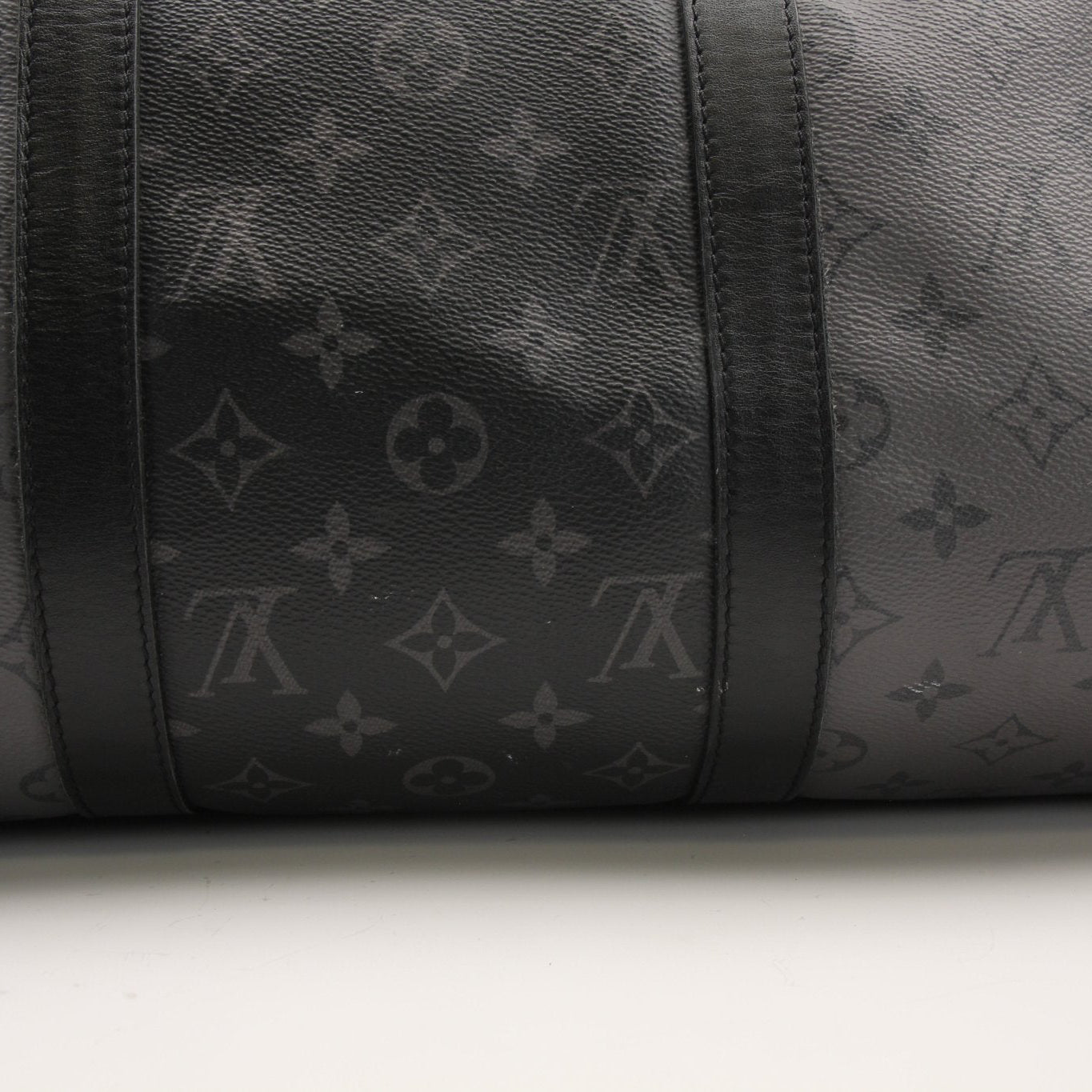 Gold & Beyond Louis Vuitton Keepall 50 travel bag with leather handles and monogram canvas, shown on a white background.