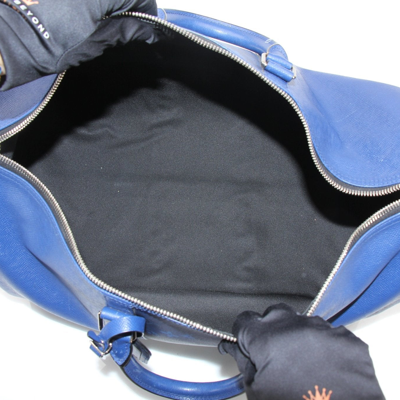 Louis Vuitton Blue Keepall 50 Bandoulière duffle bag with leather handles and gold-tone hardware, designed for travel.