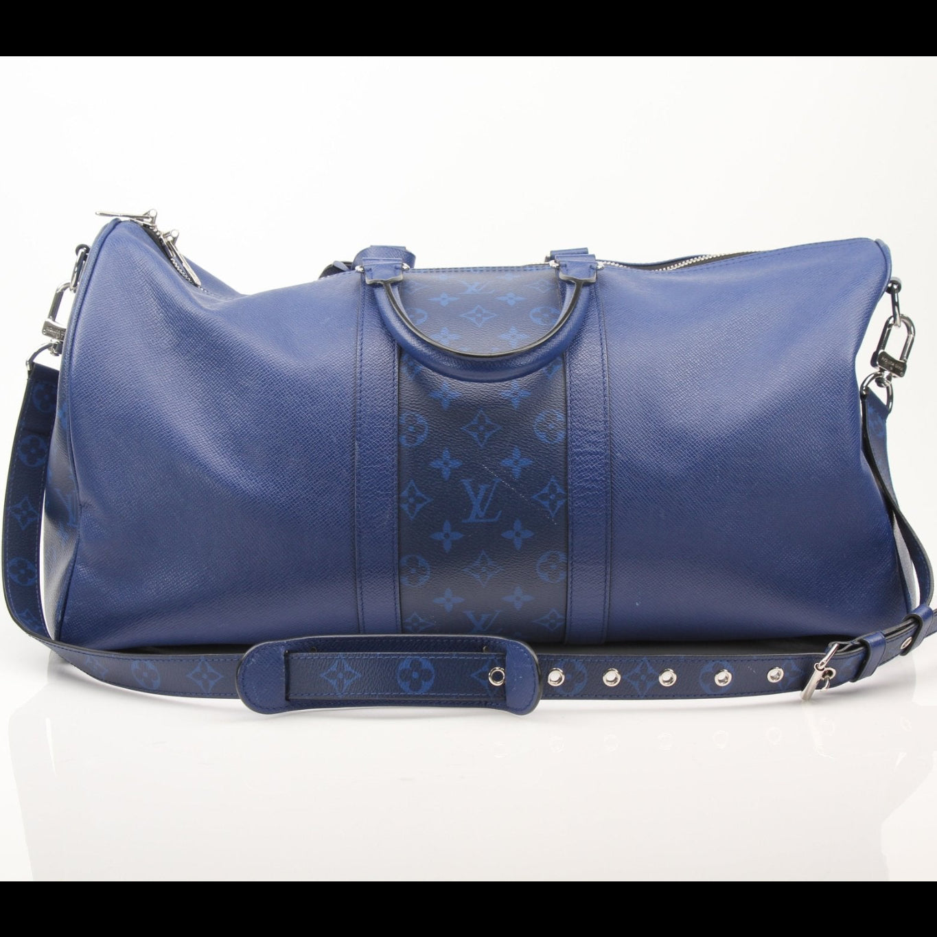 Louis Vuitton Blue Keepall 50 Bandoulière duffle bag with leather handles and gold hardware, designed for travel and spacious storage.