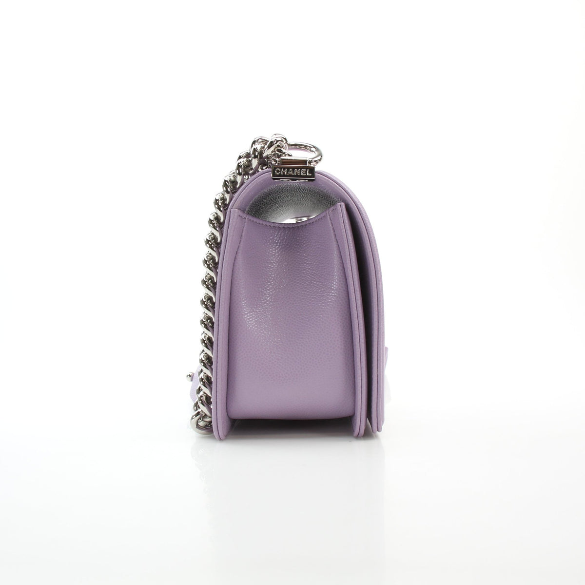 Lilac caviar leather medium Boy flap handbag by Chanel with quilted texture and signature chain strap