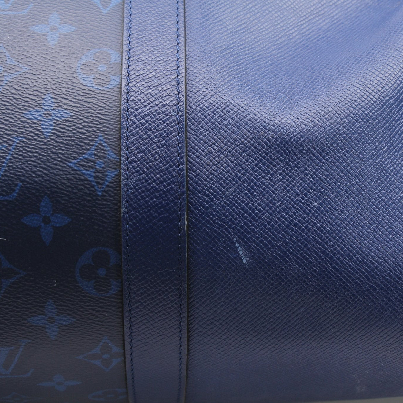 Louis Vuitton Blue Keepall 50 Bandoulière duffle bag with leather handles and straps, designed for travel and spacious storage.