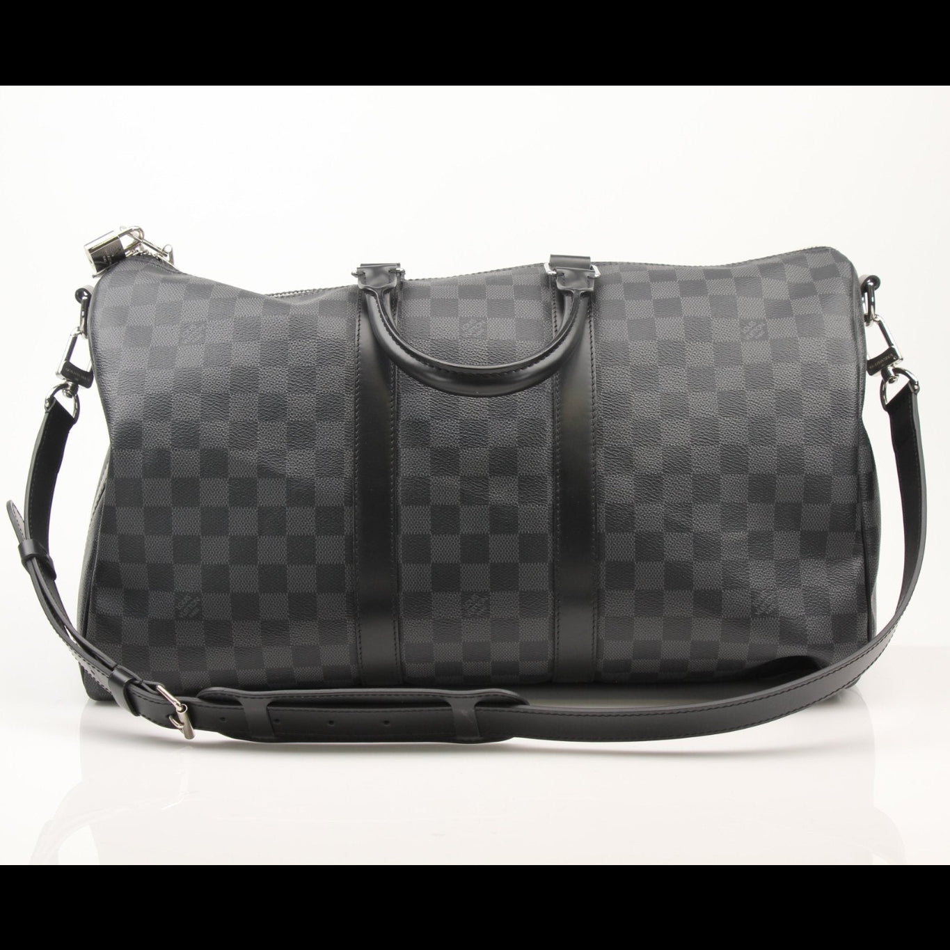 Louis Vuitton Keepall 45 Bandoulière duffle bag with leather trim and gold hardware, shown on a flat surface.
