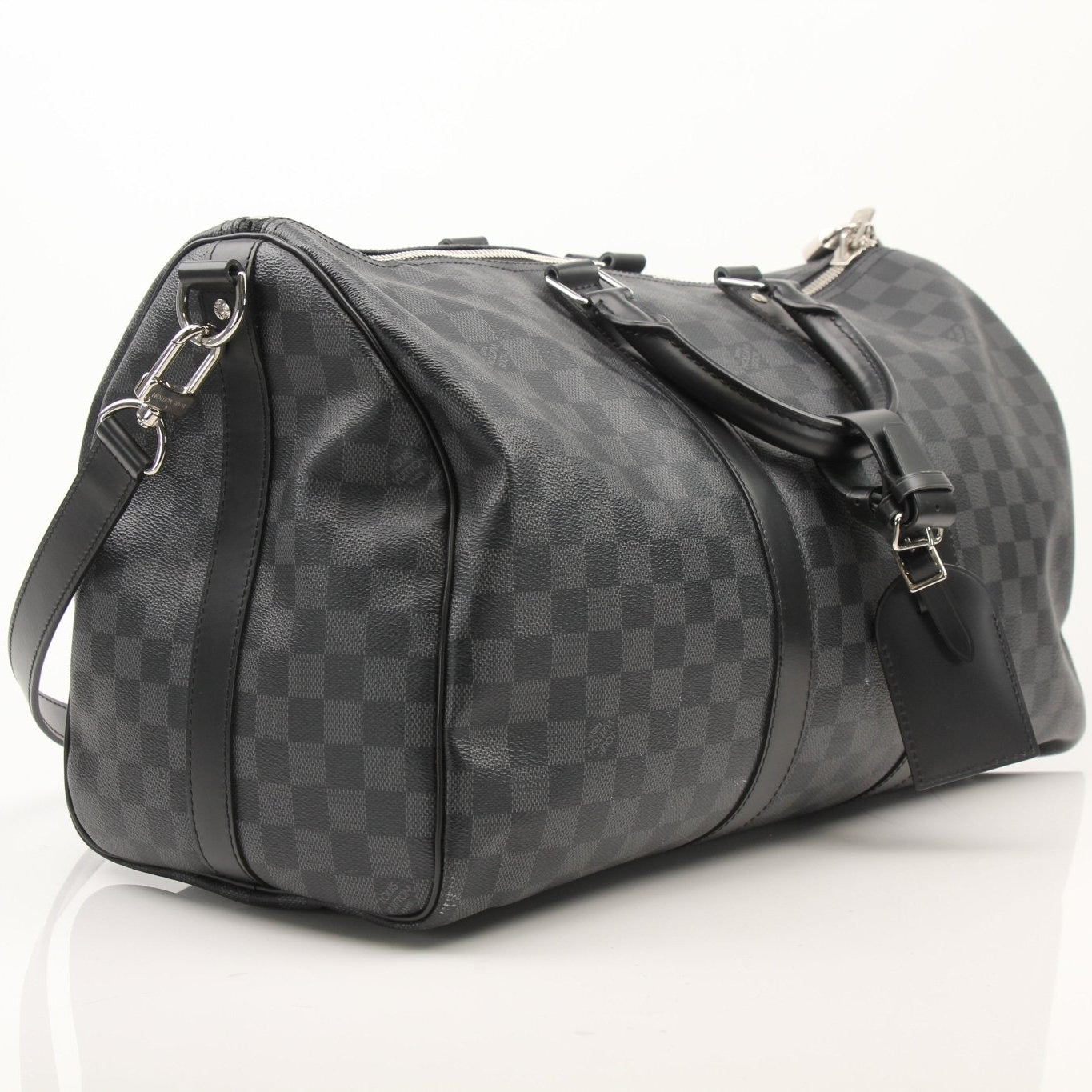 Louis Vuitton Keepall 45 Damier Graphite duffle bag with shoulder strap, spacious travel bag with signature pattern and leather accents.