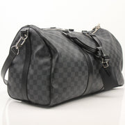Louis Vuitton Keepall 45 Bandoulière duffle bag in classic monogram canvas, with leather trim and adjustable strap.