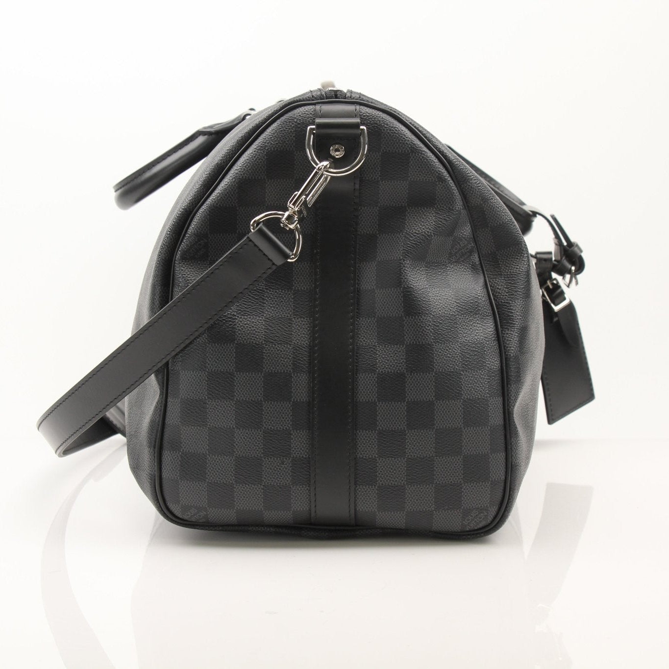 Louis Vuitton Keepall 45 Bandoulière duffle bag with leather handles and monogram canvas, designed for travel and style.