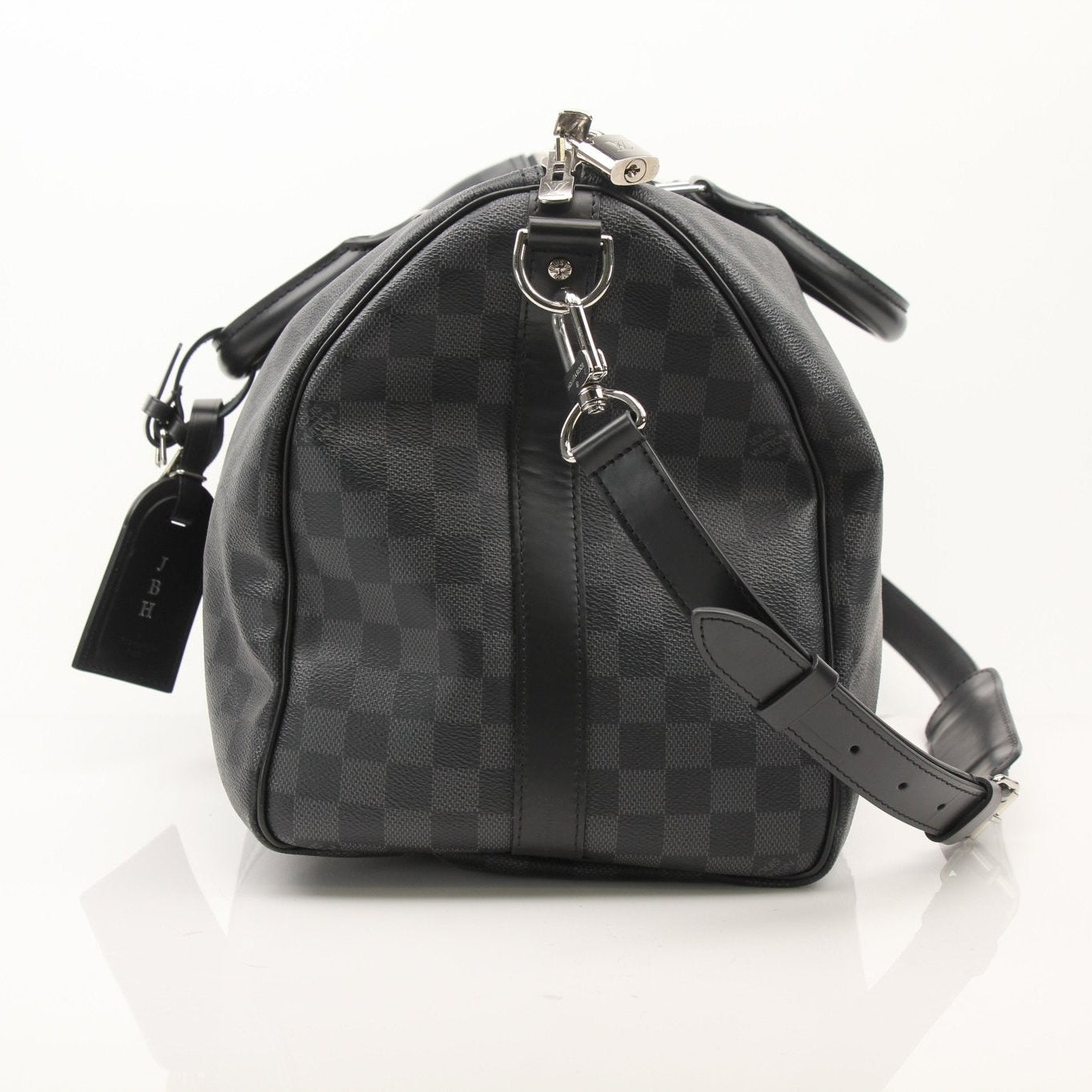 Louis Vuitton Keepall 45 Bandoulière duffle bag with leather accents, black canvas, and adjustable shoulder strap for travel.