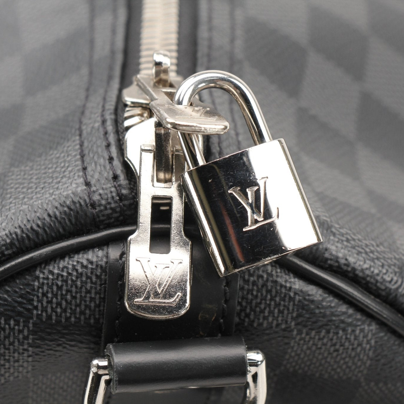 Louis Vuitton Keepall 45 Bandoulière duffle bag with leather handles and monogram canvas for travel and everyday use.