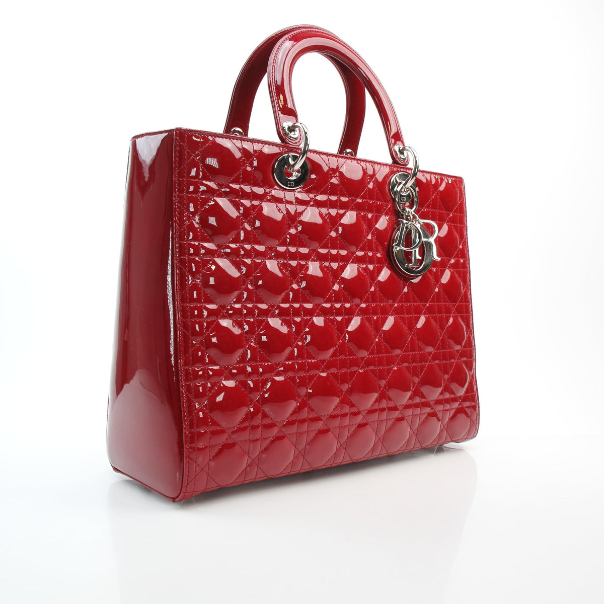 Red patent leather large Lady Dior handbag by Christian Dior with structured silhouette and top handles