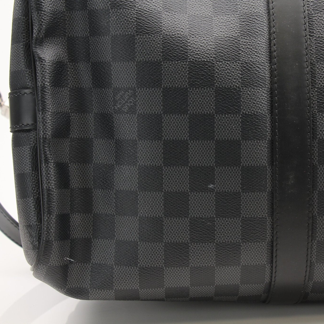 Louis Vuitton Keepall 45 Bandoulière duffle bag with leather handles and signature monogram canvas, designed for travel.