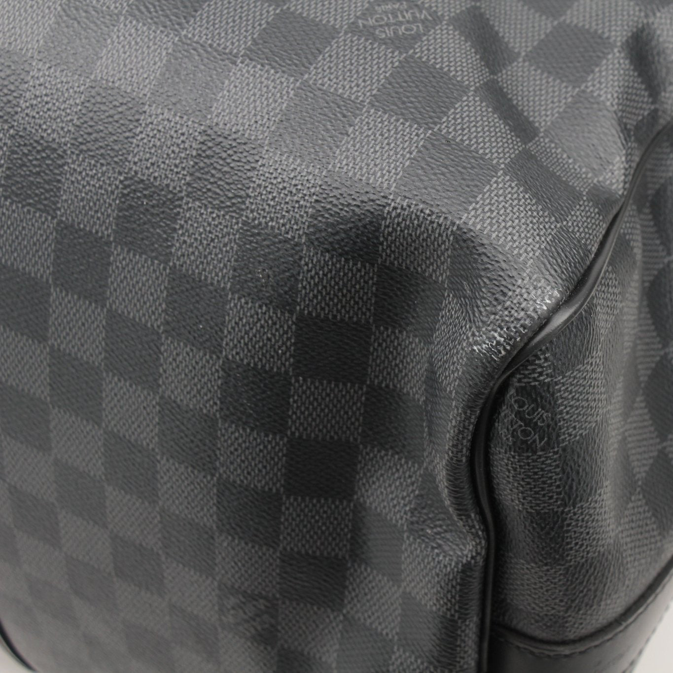 Louis Vuitton Keepall 45 Bandoulière duffle bag in brown monogram canvas with leather trim, displayed with handles and shoulder strap.
