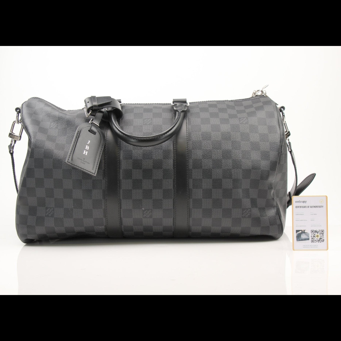 Louis Vuitton Keepall 45 Bandoulière duffle bag with monogram canvas and leather accents, resting on a surface.
