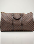 Louis Vuitton Keepall 50 Damier Ebene duffle bag in brown canvas with leather trim and handles, suitable for travel and weekend trips.