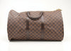 Louis Vuitton Keepall 50 Damier Ebene duffle bag with leather trim, zipper closure, and carry handles for travel.