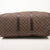 Louis Vuitton Keepall 50 Damier Ebene duffle bag with leather trim, shown in a travel bag image by Gold & Beyond