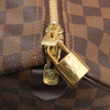 Louis Vuitton Keepall 50 Damier Ebene duffle bag for travel, featuring signature checkerboard pattern and leather handles.