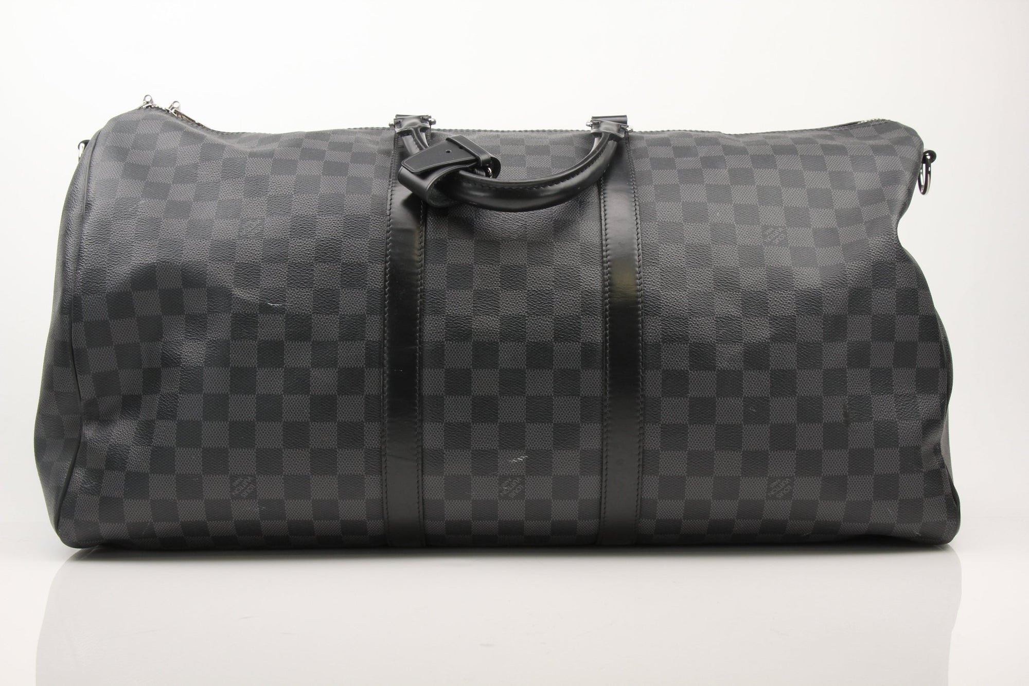 Gold & Beyond Louis Vuitton Keepall 55 Bandoulière travel bag with leather handles and signature monogram canvas.