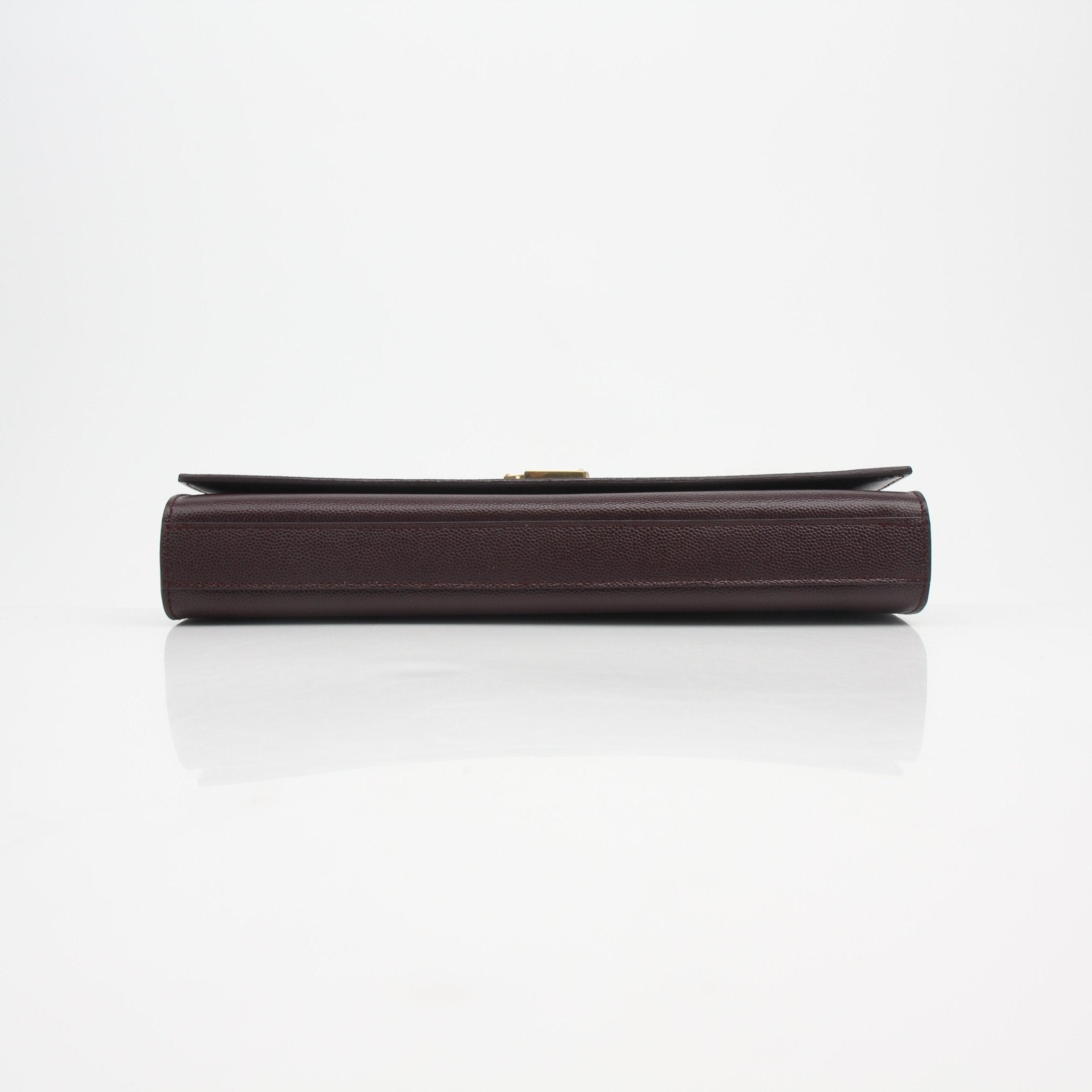 Saint Laurent Kate Grain de Poudre leather clutch handbag with gold-tone hardware and textured finish, stylish and compact for evening use.