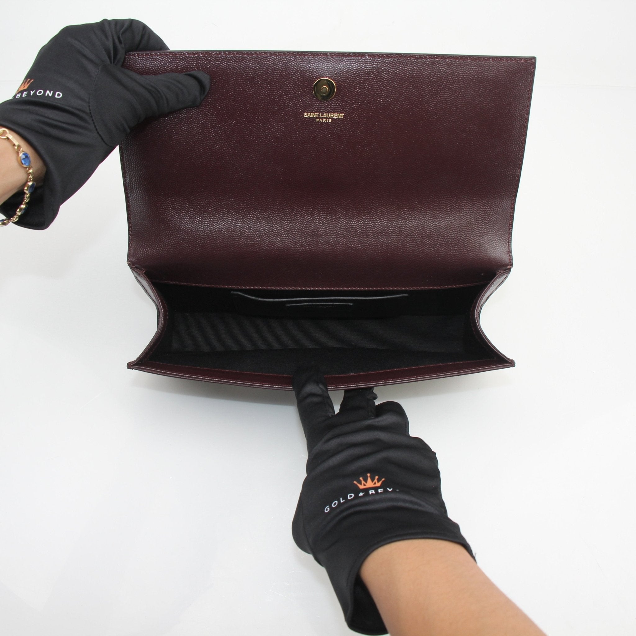 Gold & Beyond Saint Laurent Kate Grain de Poudre leather clutch handbag with sleek design and textured finish.