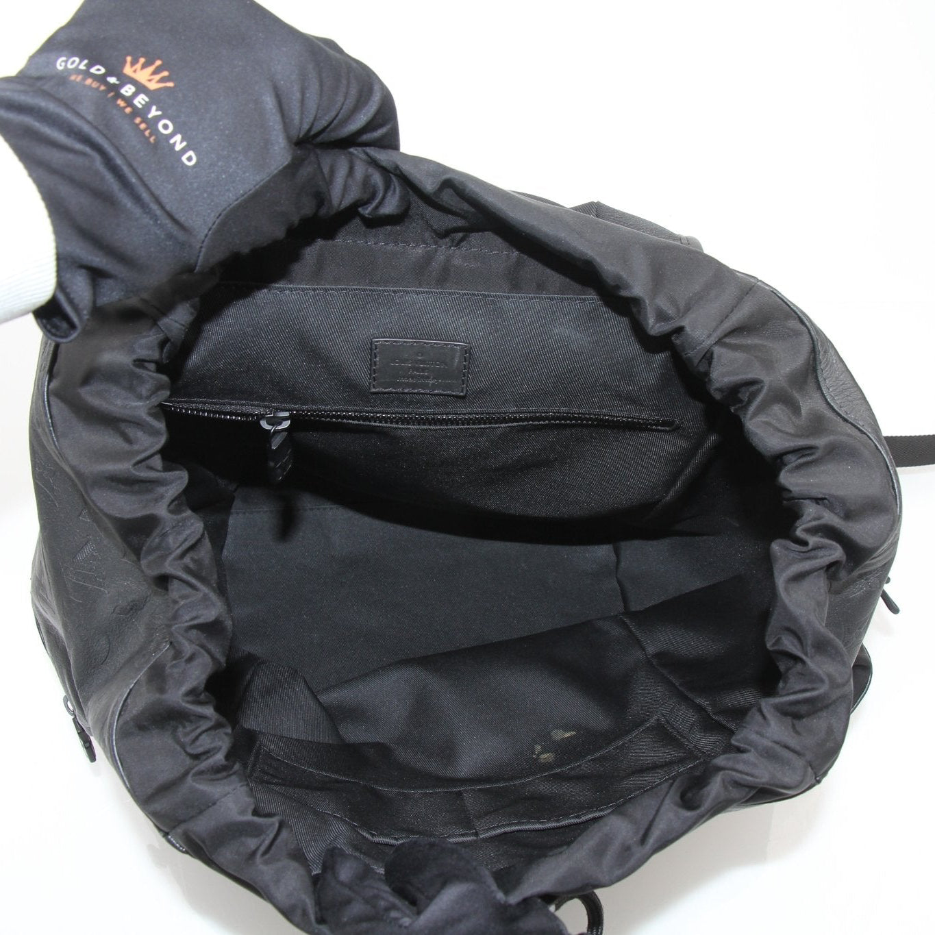 Louis Vuitton Discovery Backpack by Gold & Beyond, stylish travel bag with leather accents and spacious compartments.