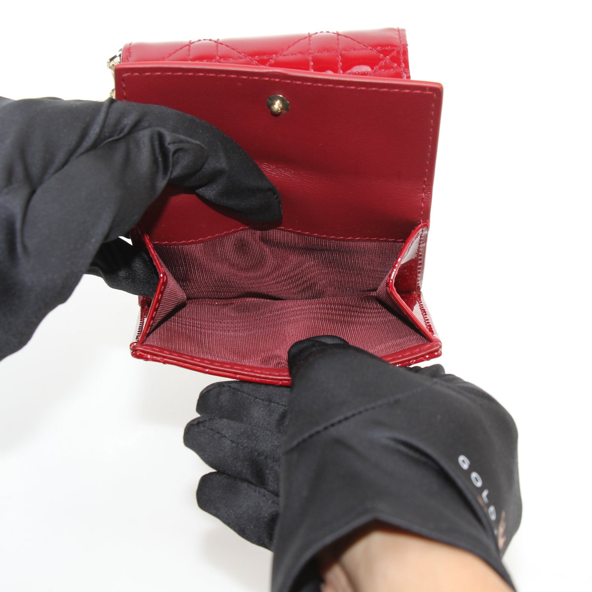 Red Christian Dior Lady Dior Lotus wallet by Gold & Beyond, showcasing quilted leather and signature hardware