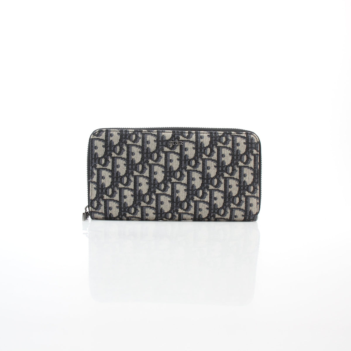 Christian Dior navy blue Oblique jacquard Voyager zipped wallet with visible zip closure and compact design