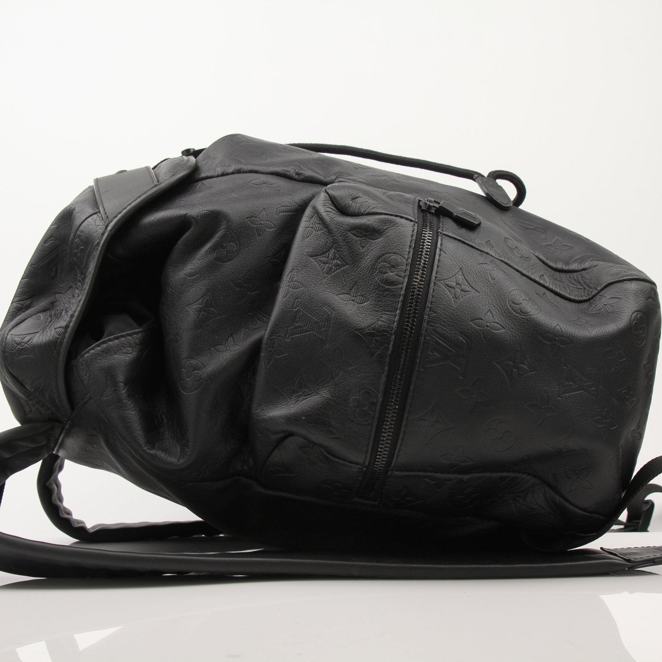 Gold & Beyond Louis Vuitton Discovery Backpack for travel, showing the stylish design and multiple compartments of the bag.