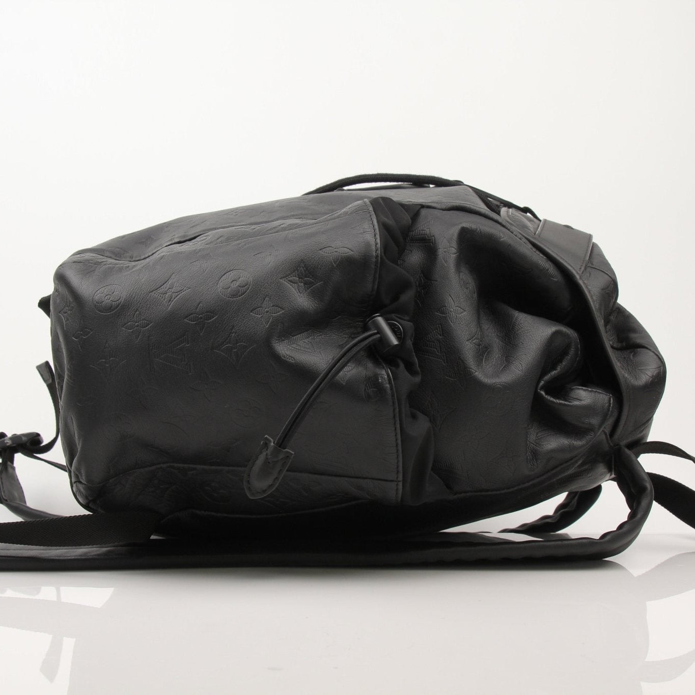 Louis Vuitton Discovery Backpack by Gold & Beyond, stylish travel bag with leather accents and spacious interior, viewed from the front.