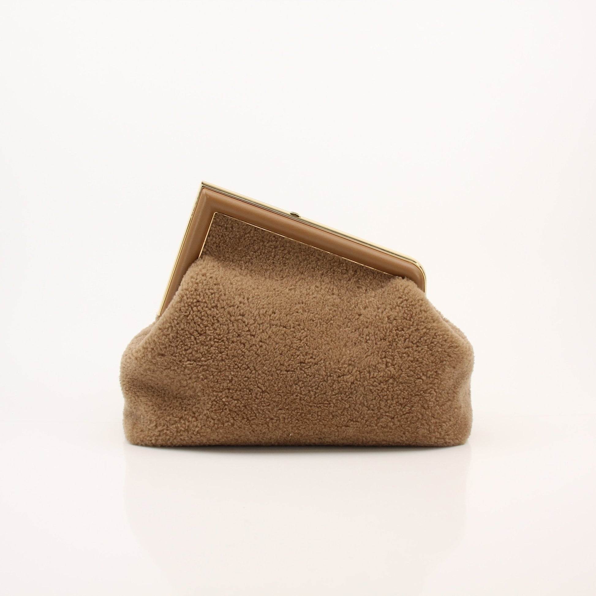 Fendi Shearling First Camel Handbag with gold-tone hardware, soft shearling exterior, and structured design.