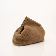 Fendi Shearling First Camel Handbag with gold hardware, soft shearling exterior, and structured design, stylishly displayed.
