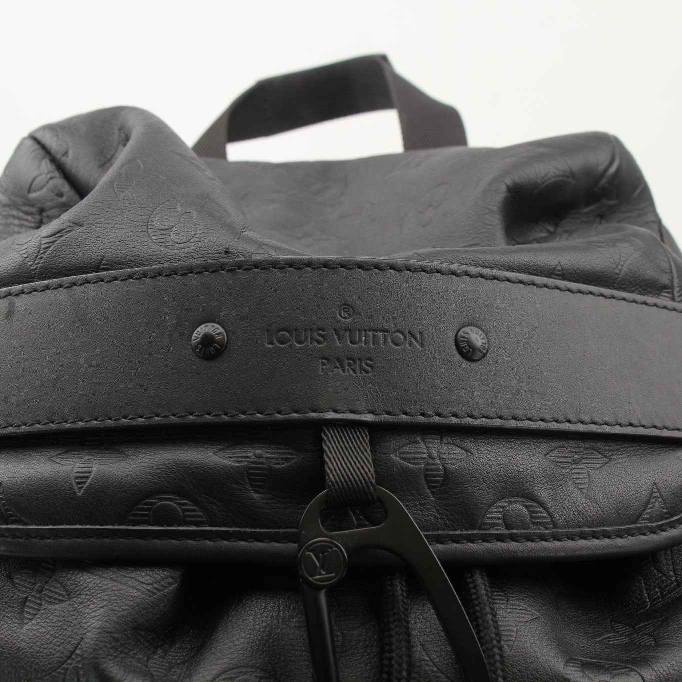 Louis Vuitton Discovery Backpack from Gold & Beyond, stylish travel bag with leather accents and spacious interior.