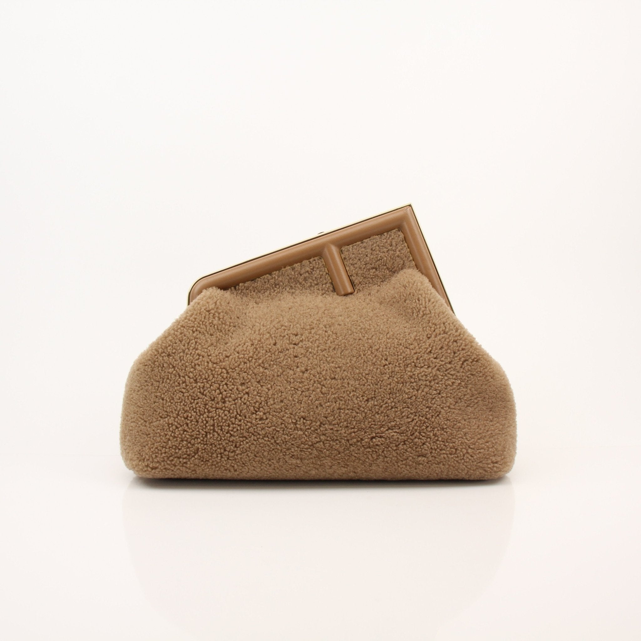 Fendi Shearling First Camel handbag with gold hardware, soft shearling exterior, and structured design.