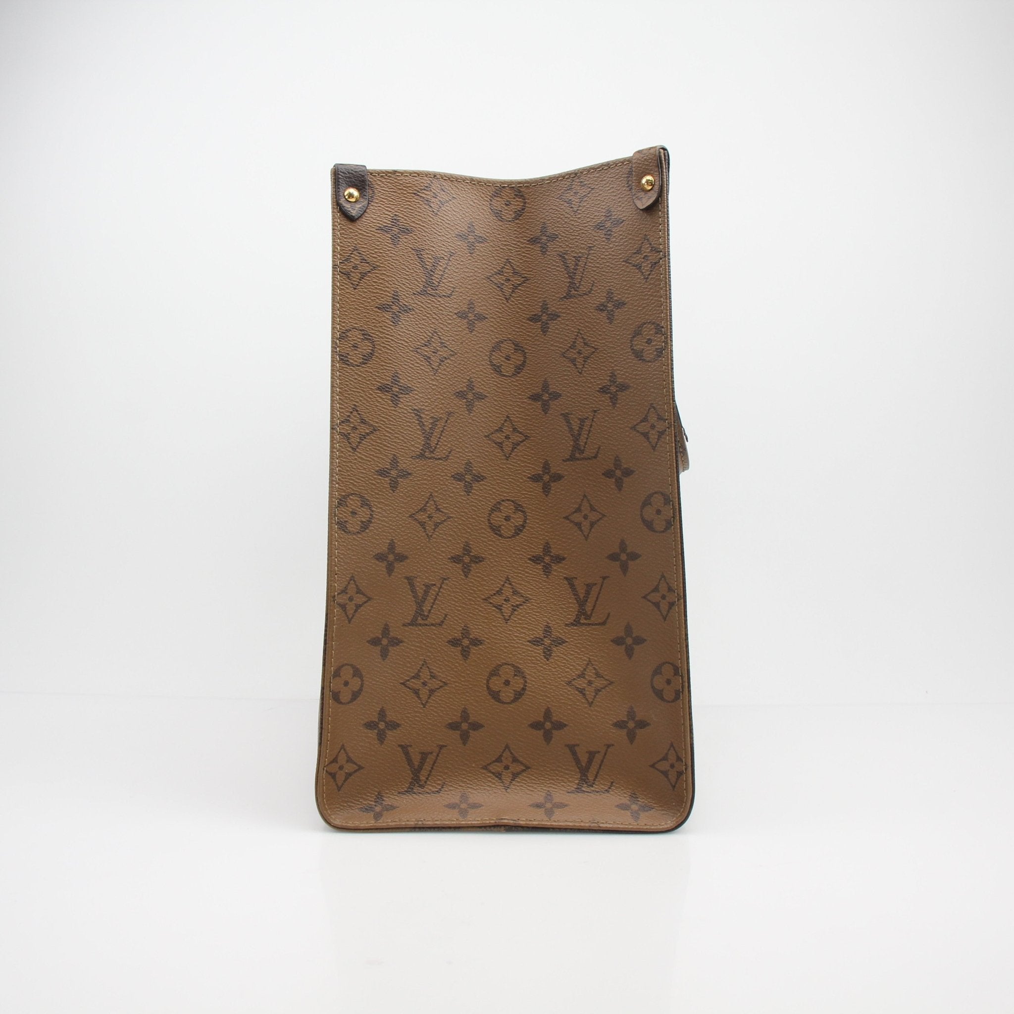 Louis Vuitton Reverse Monogram Giant OnTheGo GM tote bag with gold-tone hardware and dual top handles, crafted from coated canvas.