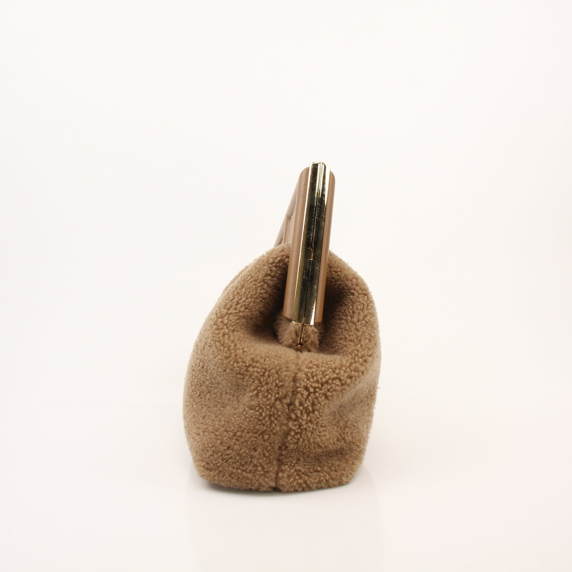 Fendi Shearling First Camel Handbag with gold hardware and adjustable strap, featuring soft shearling material and structured design.