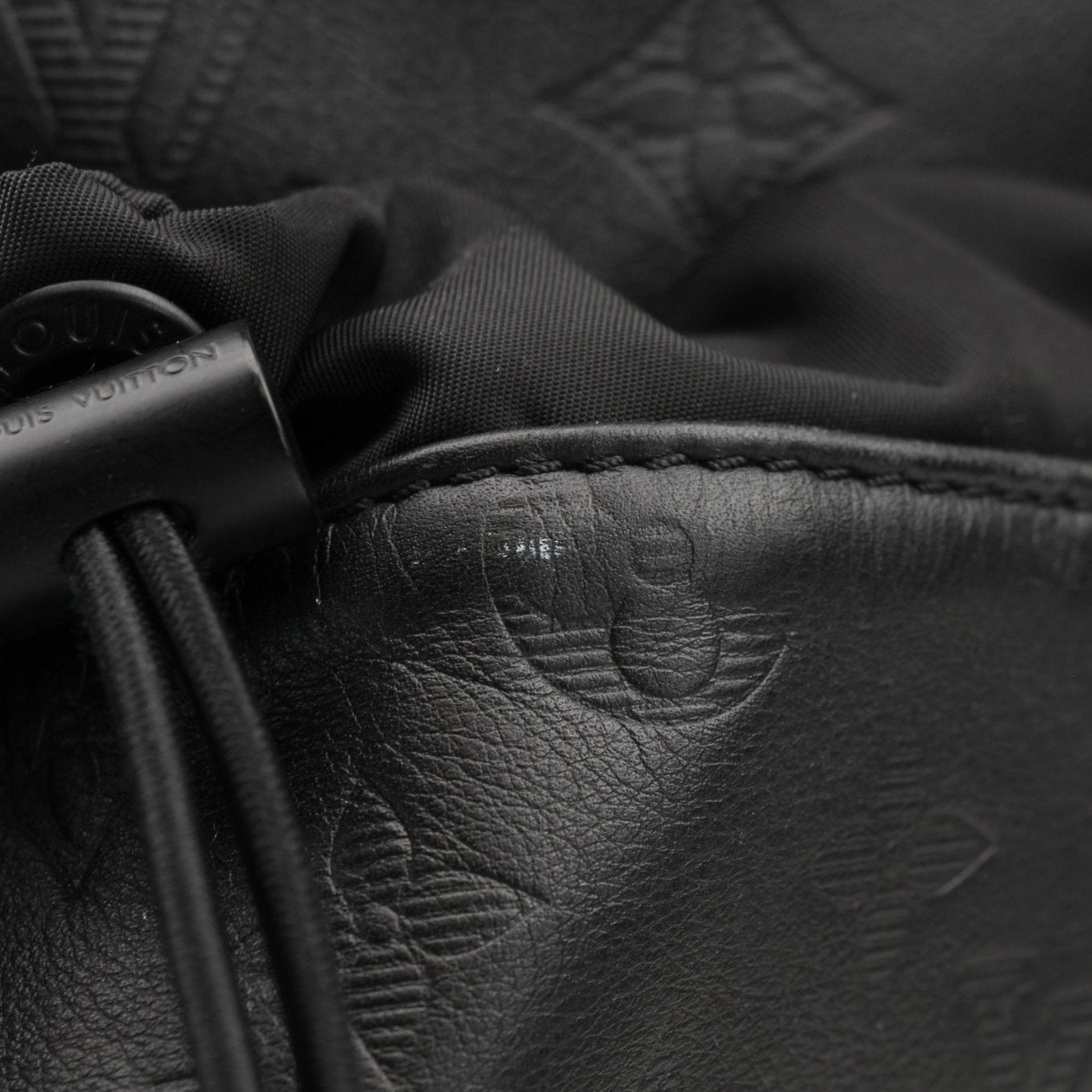 Louis Vuitton Discovery Backpack by Gold & Beyond, stylish travel bag with leather details, shown from the front view.