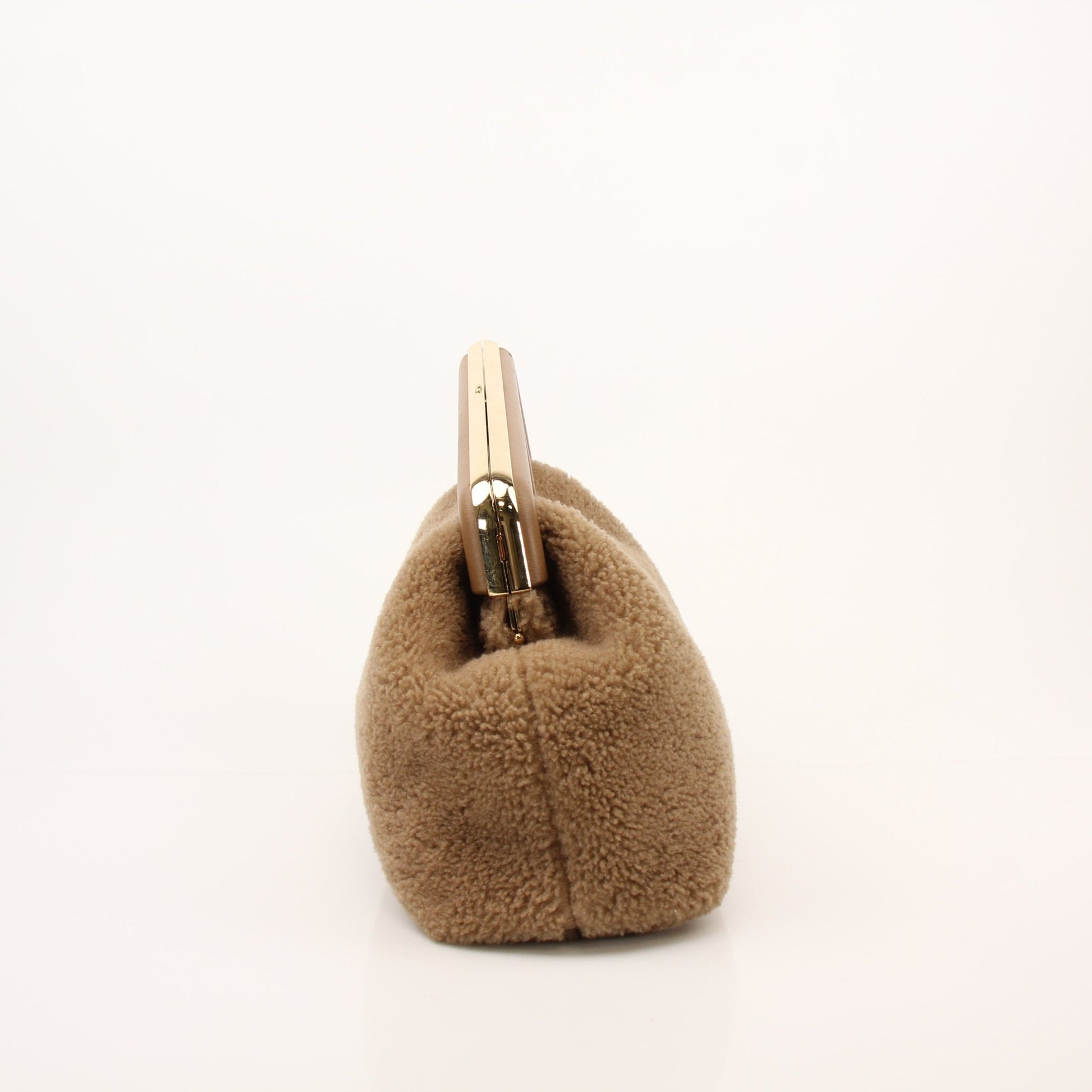 Fendi Shearling First Camel Handbag with gold hardware, featuring plush shearling material and structured design.