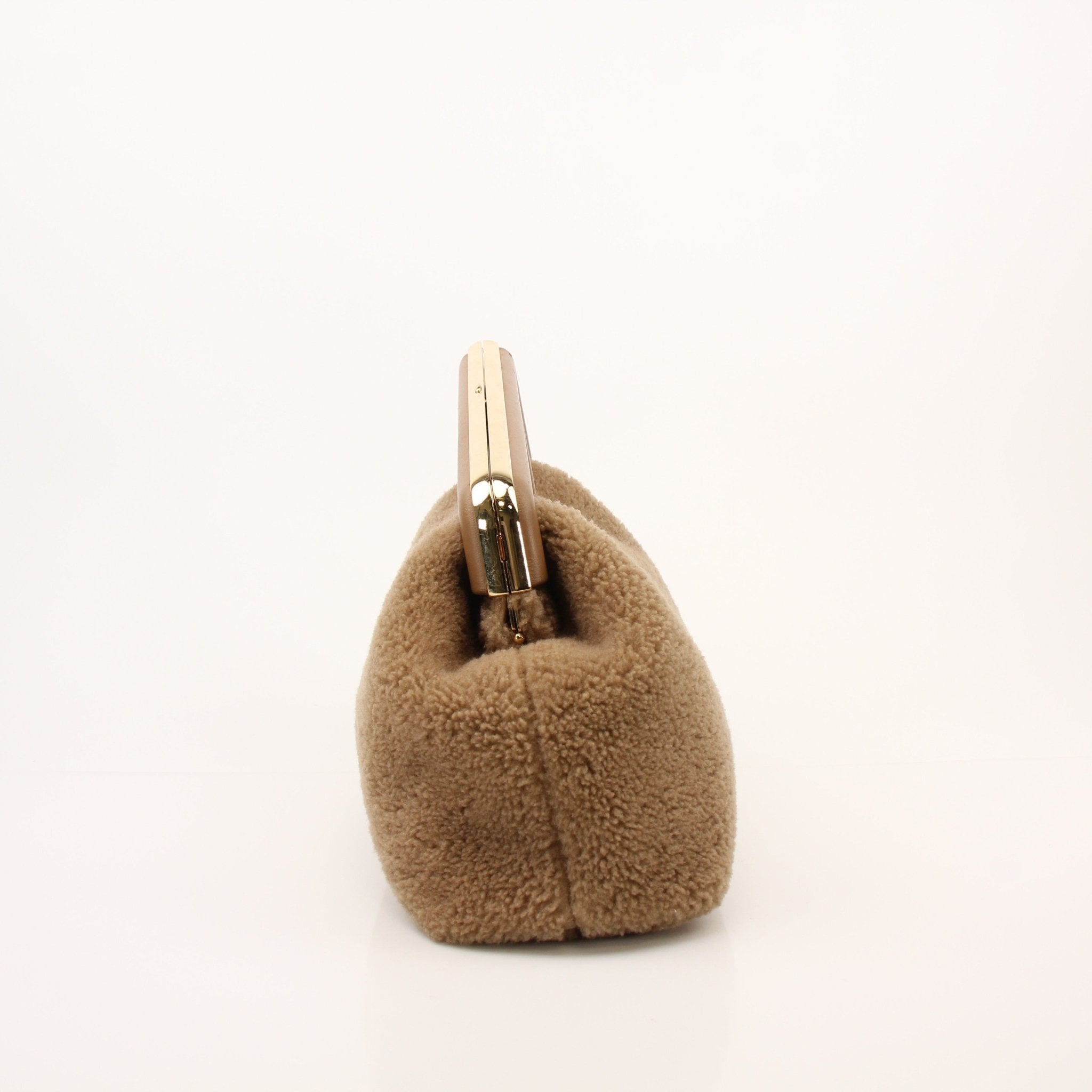 Fendi Shearling First Camel Handbag with gold hardware, featuring plush shearling material and structured design.