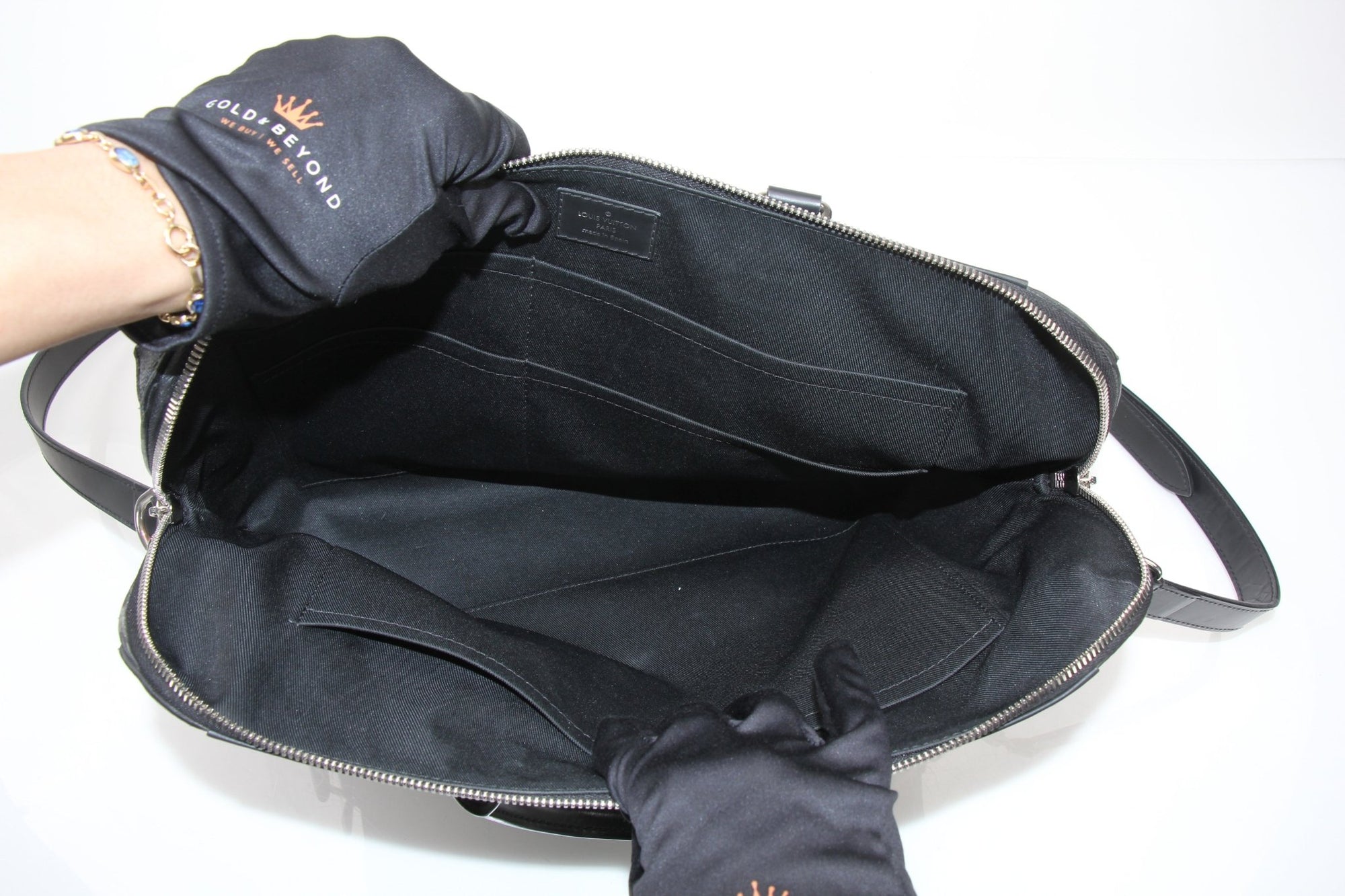 Louis Vuitton Porte-Documents Voya briefcase in black leather, features gold hardware and sleek design, ideal for travel and professional use.