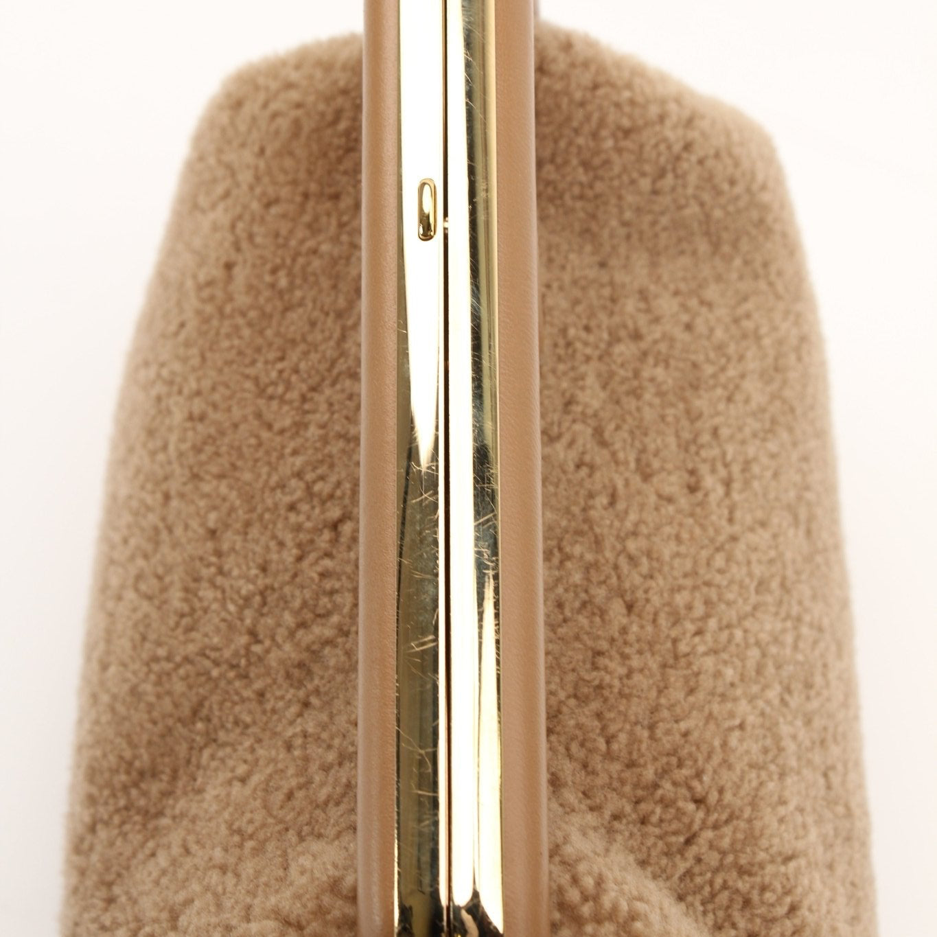 Fendi Shearling First Camel Handbag with gold hardware, soft shearling exterior, and structured design.