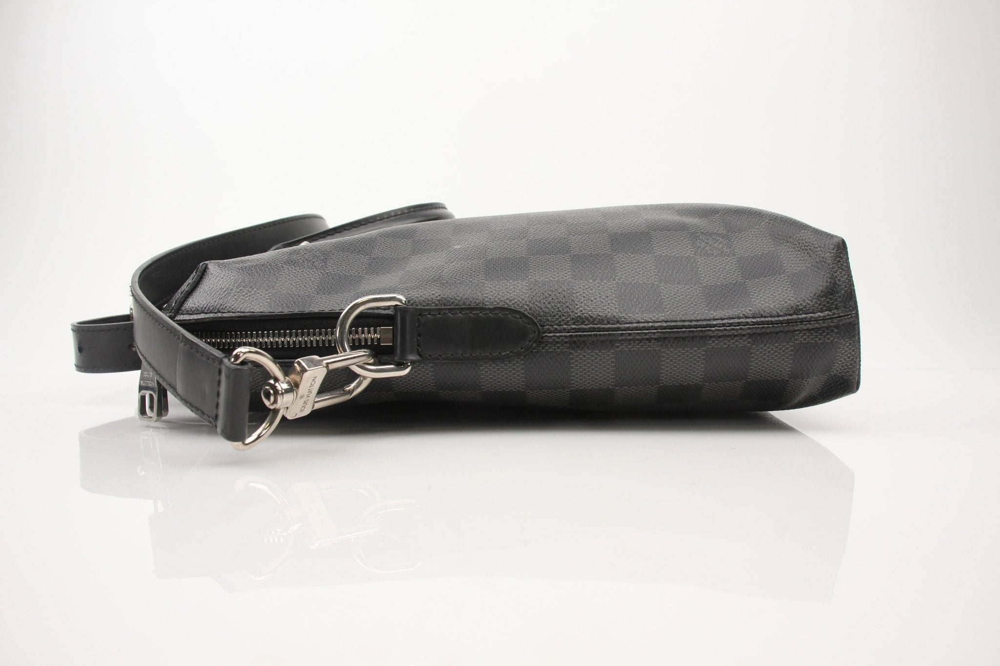 Gold & Beyond Louis Vuitton Porte-Documents Voya briefcase for travel, featuring sleek design and leather accents.