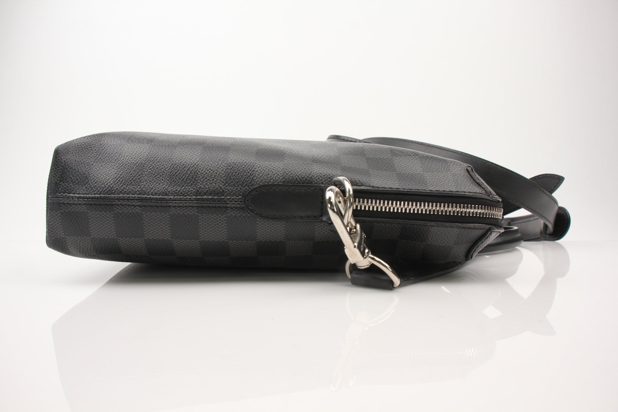 Gold & Beyond Louis Vuitton Porte-Documents Voya briefcase, a stylish travel bag with leather accents and multiple compartments.