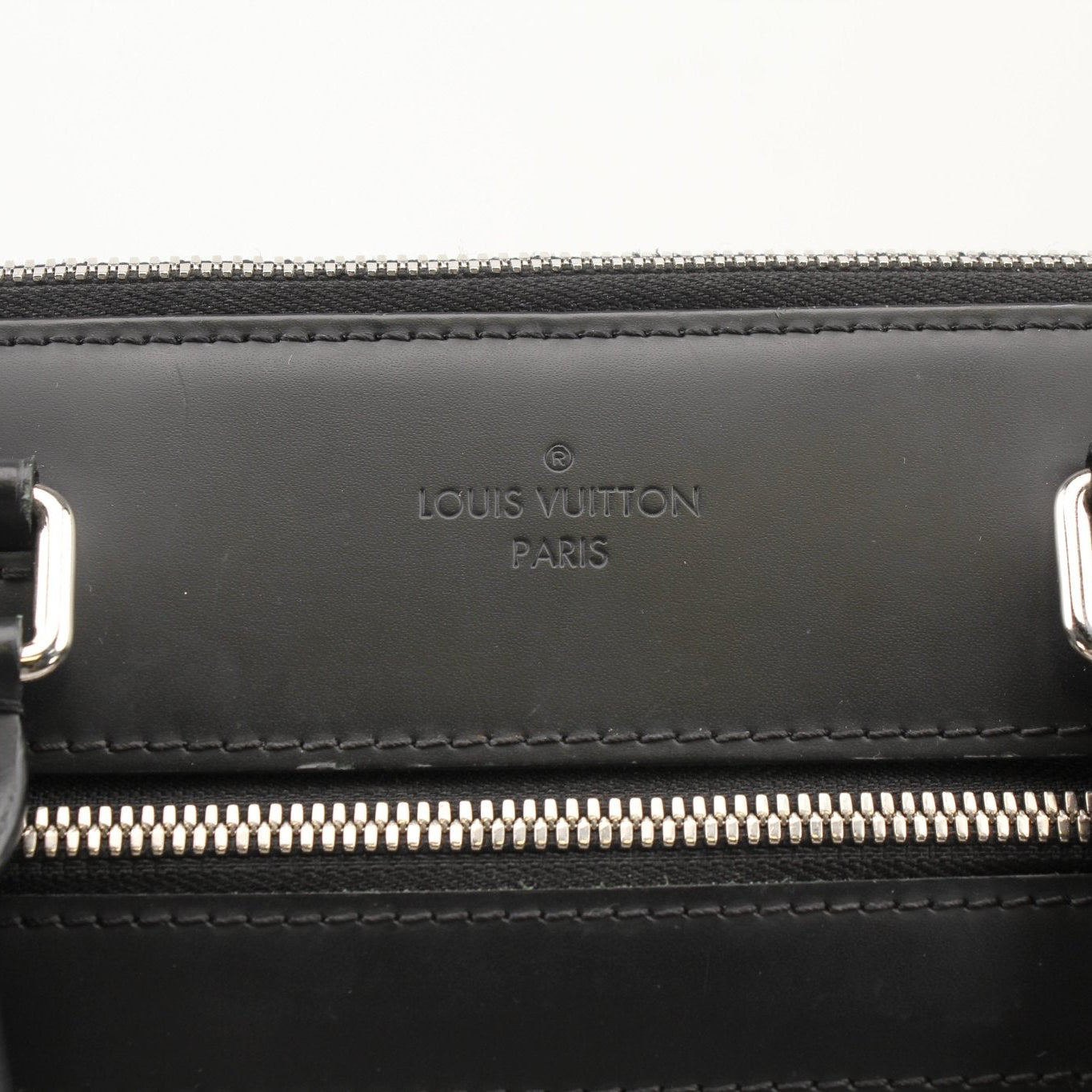 Gold & Beyond Louis Vuitton Porte-Documents Voya briefcase for travel, shown with leather exterior and structured design.