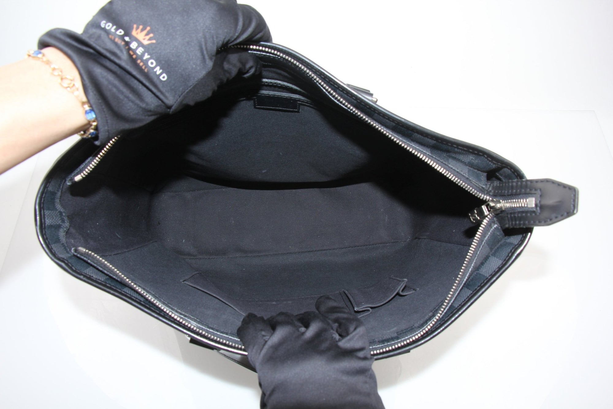 Louis Vuitton Tada Tote travel bag by Gold &amp; Beyond, showcasing sleek design and spacious interior for travel essentials.