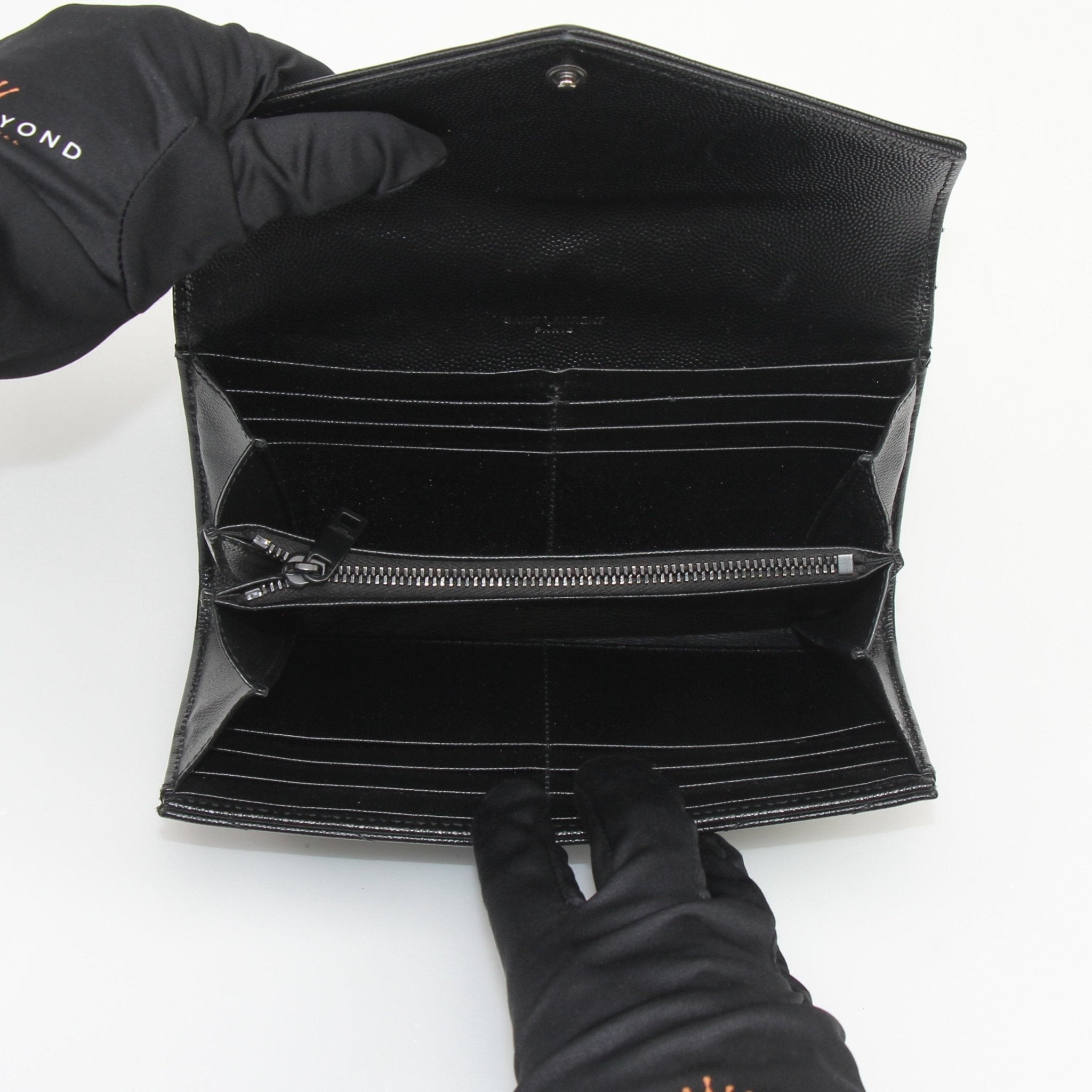 Gold & Beyond Saint Laurent Grain de Poudre Chevron Envelope Wallet handbag with textured leather and sleek design.